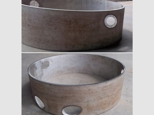 These parts were waterjet cut and then roll formed, after which the angled oblong cuts became round concentric holes through the walls of the tube.