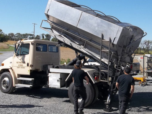 We built this stainless steel coal truck body and rebuilt the truck's scissor lift mechanism.