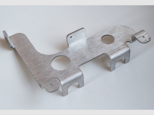 Waterjet cut and formed stainless steel part.